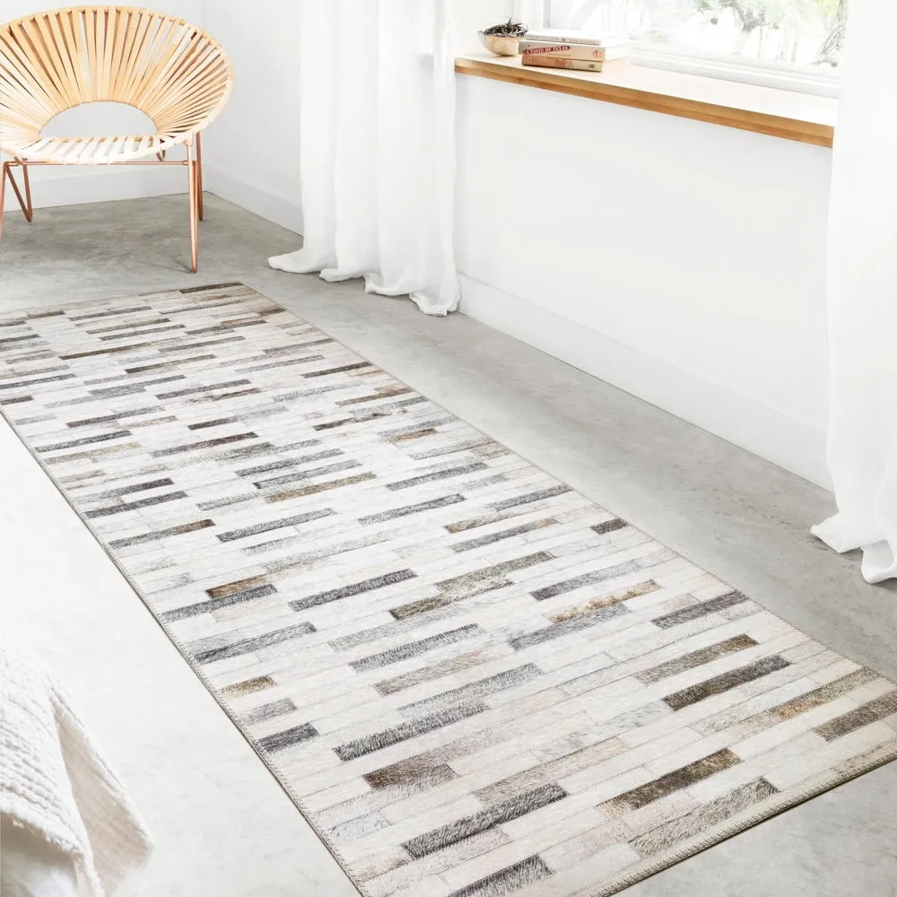 Alexander Home Davide Printed Faux Cowhide Area Rug