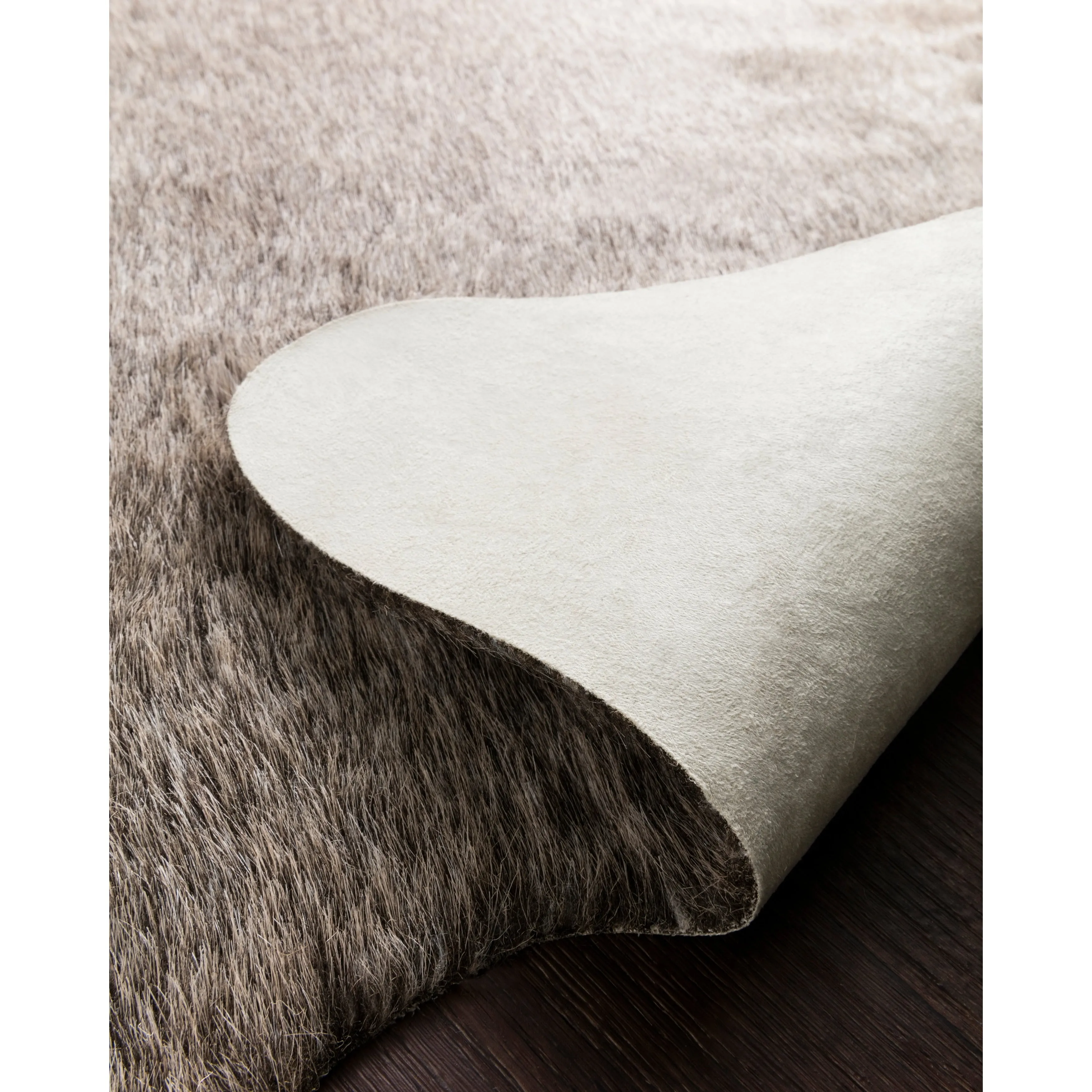 Alexander Home Faux Cowhide Area Rug