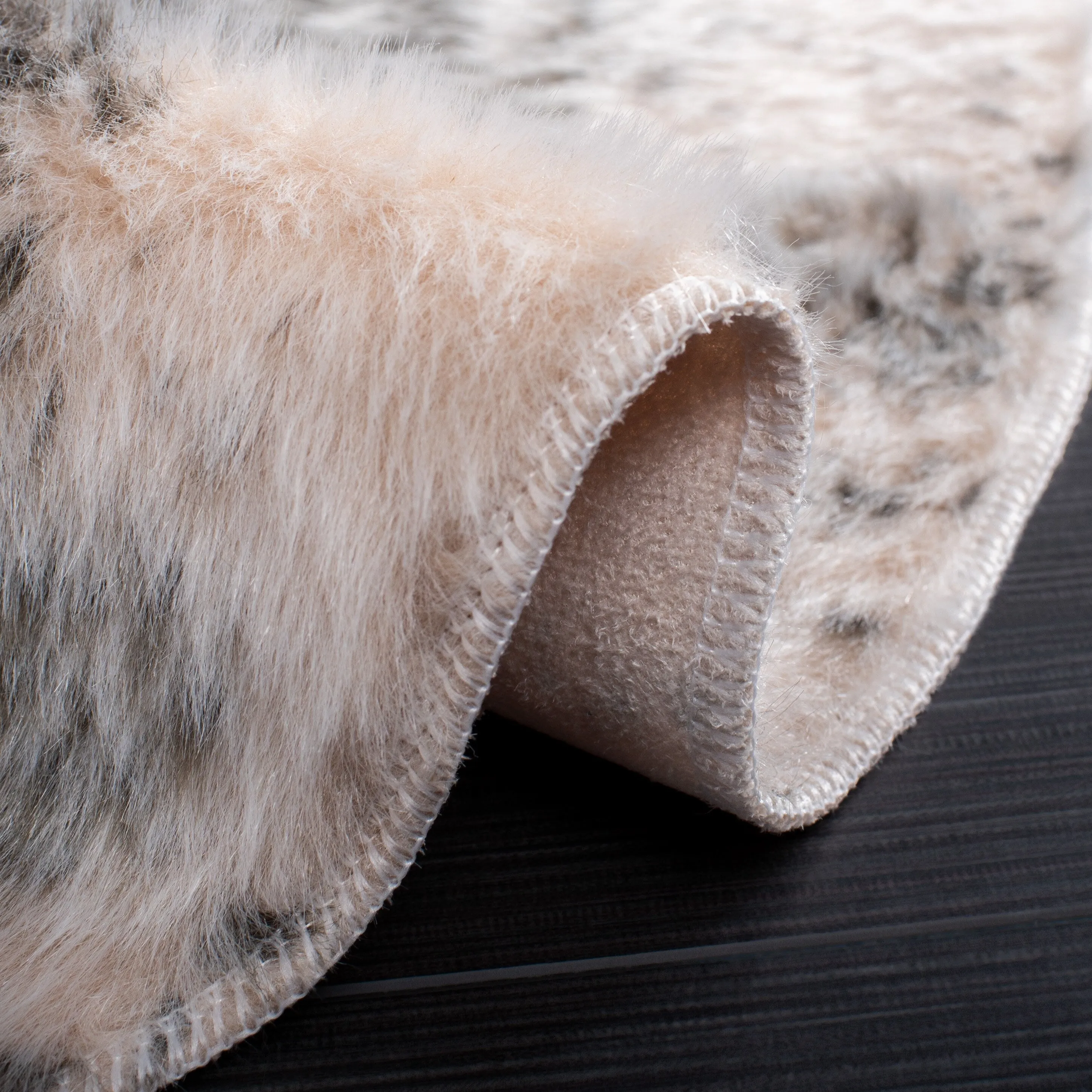 SAFAVIEH Faux Cow Hide Sinne Animal Rug
