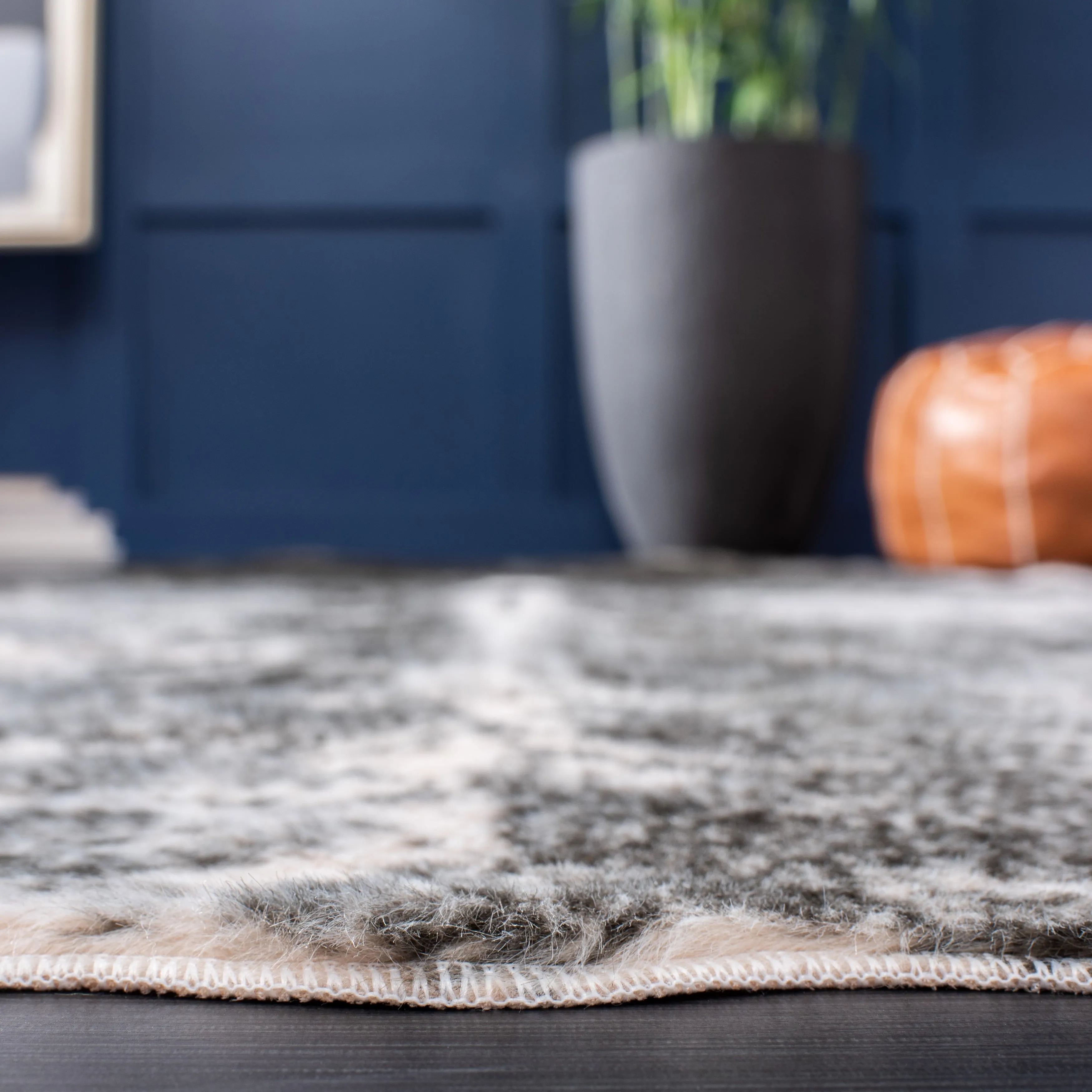 SAFAVIEH Faux Cow Hide Sinne Animal Rug