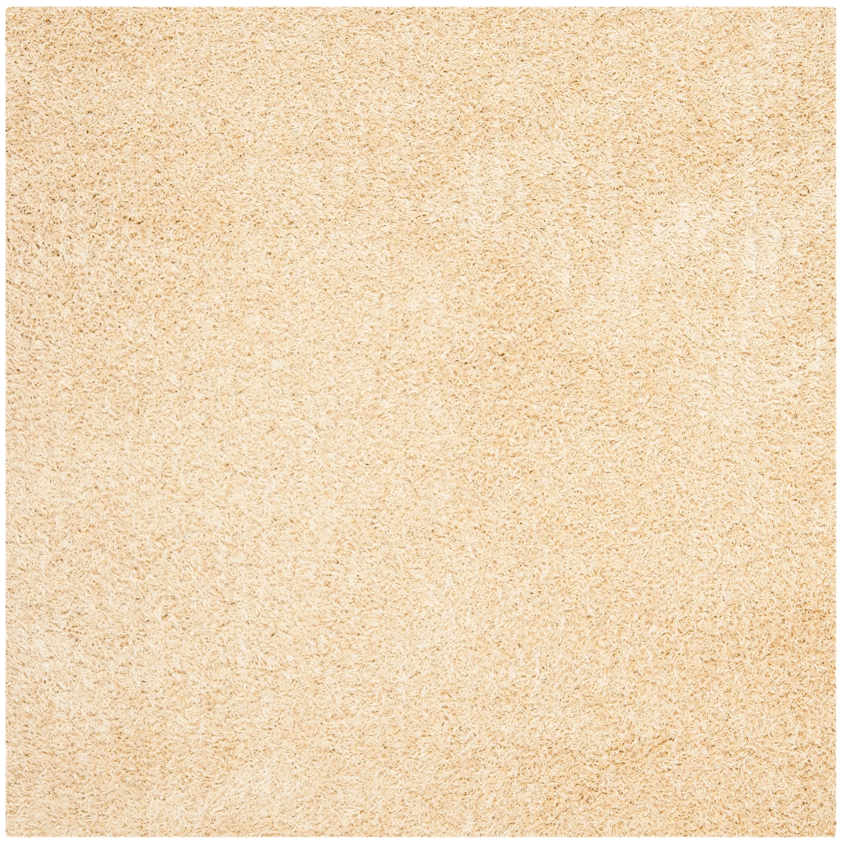 SAFAVIEH Handmade Rubi Shag Mevlide Solid Polyester Rug