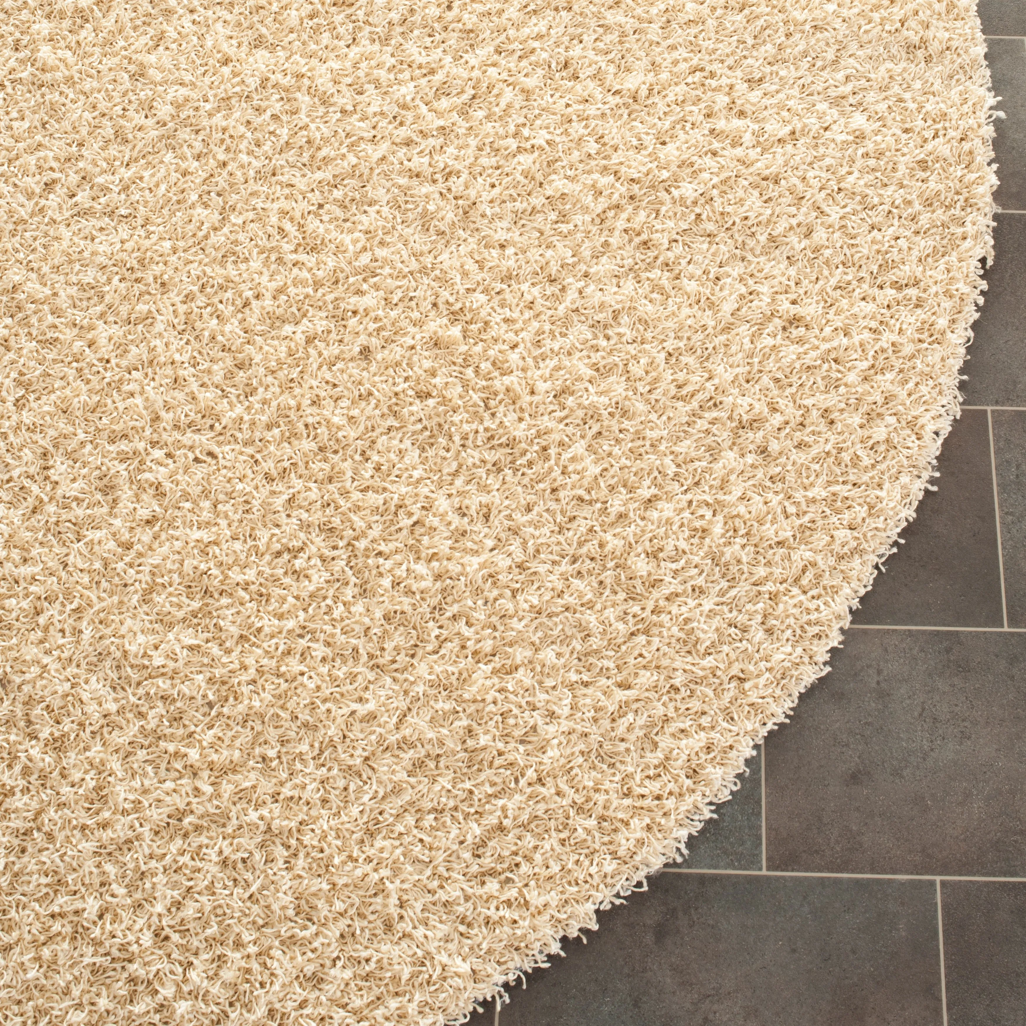 SAFAVIEH Handmade Rubi Shag Mevlide Solid Polyester Rug