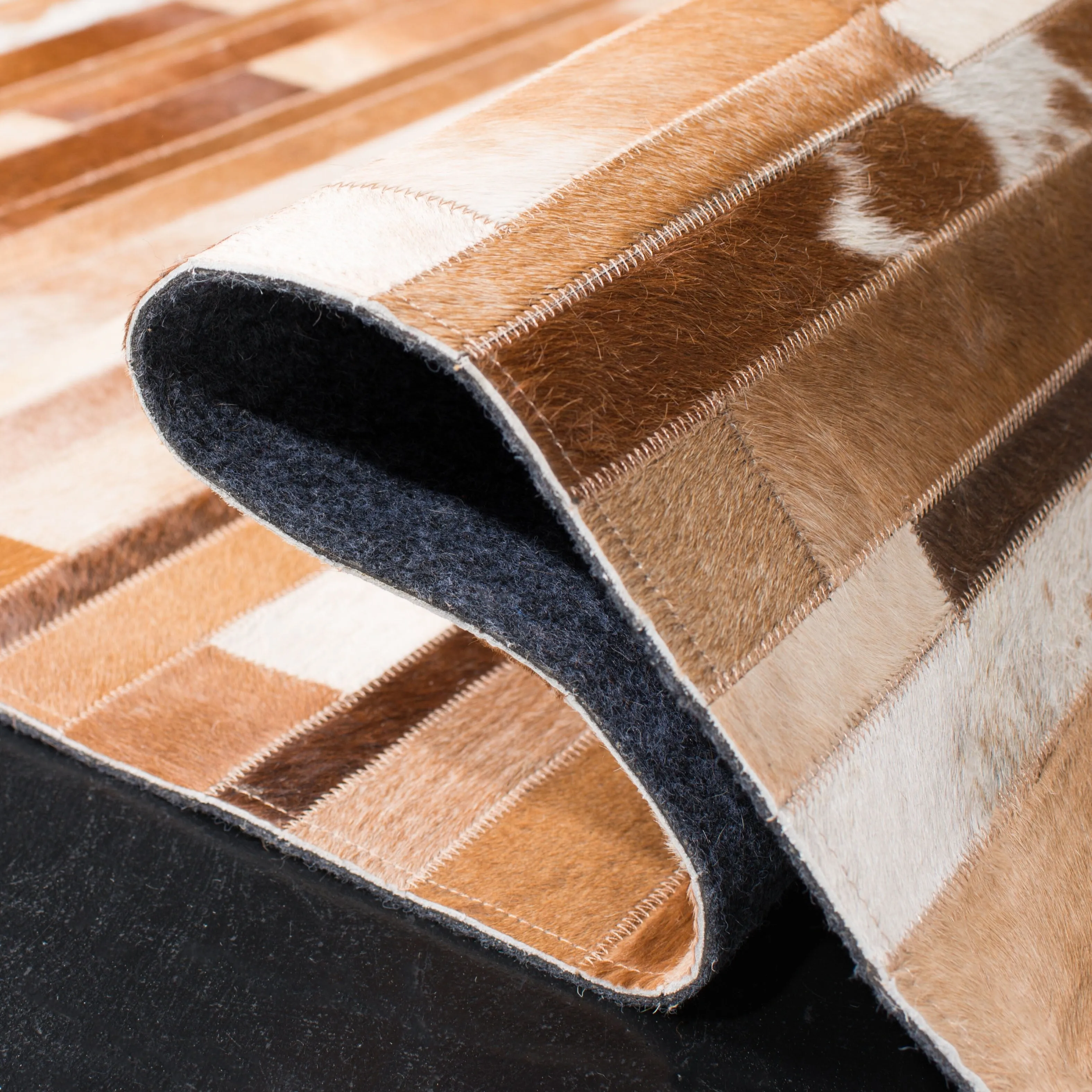 SAFAVIEH Handmade Studio Leather Tennille Modern Leather Rug