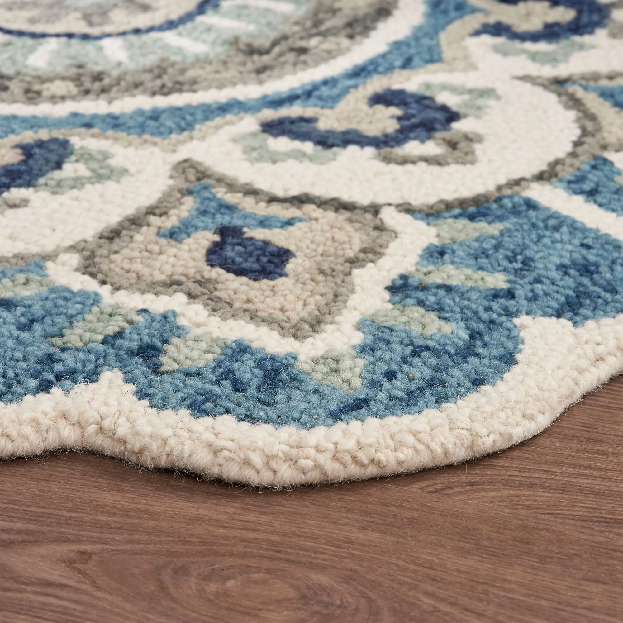 Sevita Hand Tufted Edged Floral Wool Rug
