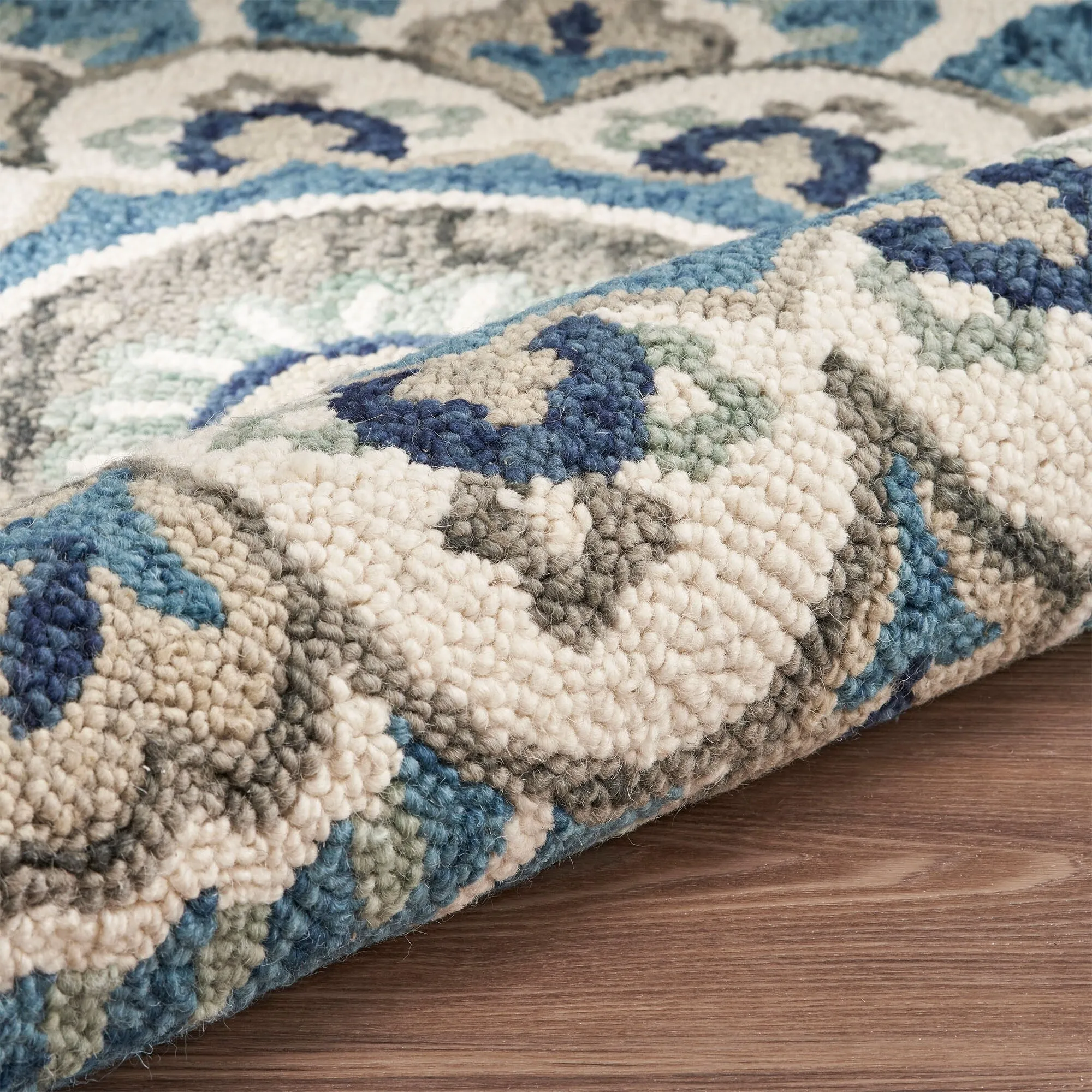 Sevita Hand Tufted Edged Floral Wool Rug