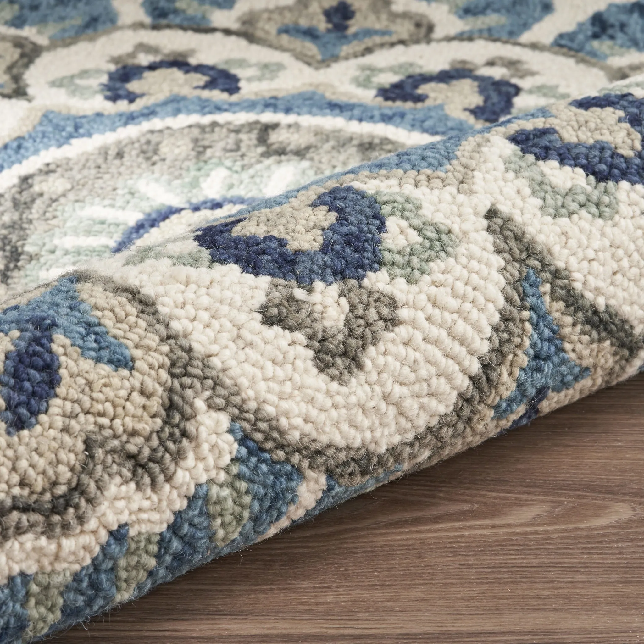 Sevita Hand Tufted Edged Floral Wool Rug