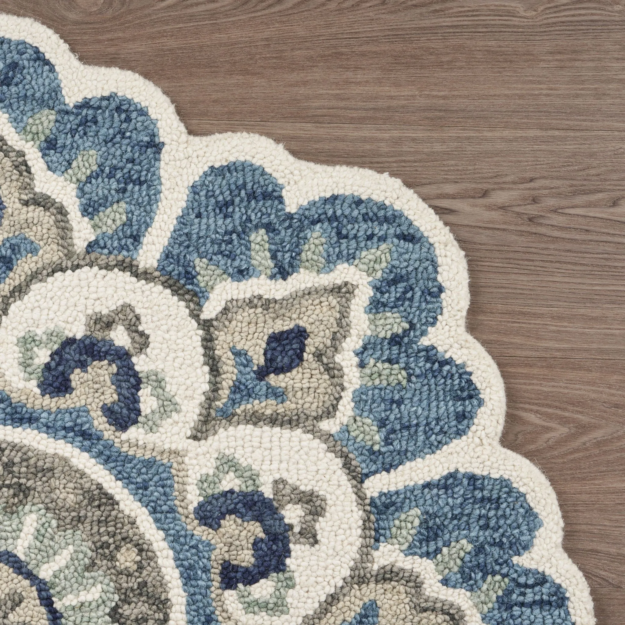 Sevita Hand Tufted Edged Floral Wool Rug