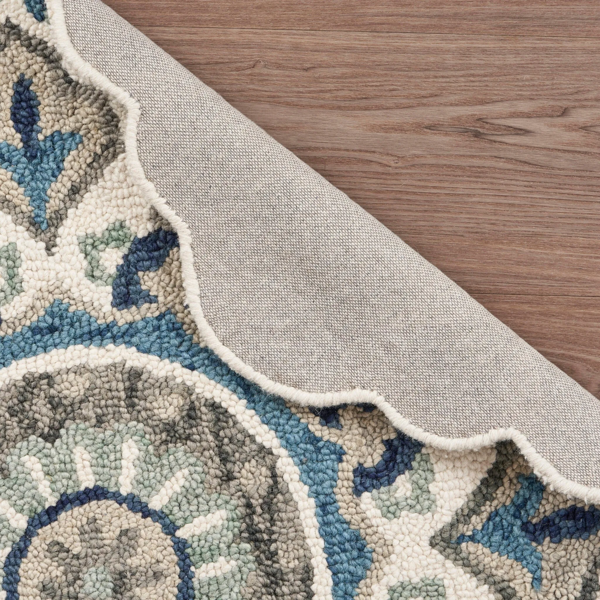 Sevita Hand Tufted Edged Floral Wool Rug